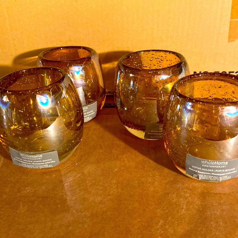 Set of four candle holders